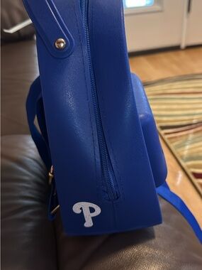 Blue backpack Phillies logo on side Croc charms fit in the bogg style bag